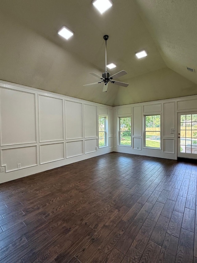 13102 Lake Mist Dr, Cypress, TX 77429 - unfurnished room with a decorative wall, dark wood finished floors, ceiling fan, and vaulted ceiling