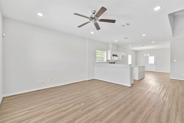 3907 Lynnfield St, Houston, TX 77016 - unfurnished living room featuring light wood-style floors, plenty of natural light, recessed lighting, baseboards, and a ceiling fan