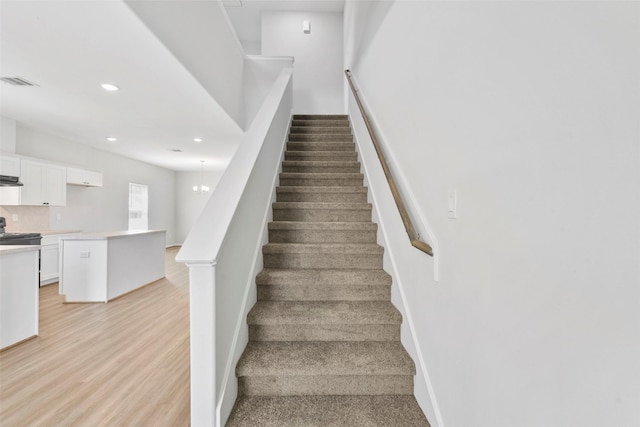 3907 Lynnfield St, Houston, TX 77016 - staircase with recessed lighting, wood finished floors, and baseboards