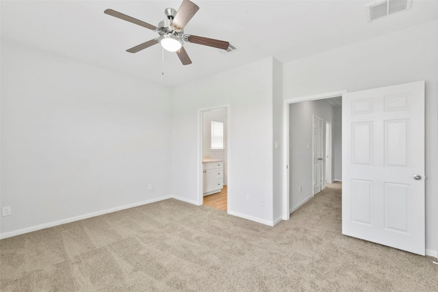 3907 Lynnfield St, Houston, TX 77016 - unfurnished bedroom featuring light carpet, baseboards, connected bathroom, and ceiling fan