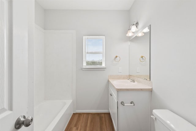3907 Lynnfield St, Houston, TX 77016 - full bath featuring wood finished floors, toilet, vanity, and baseboards