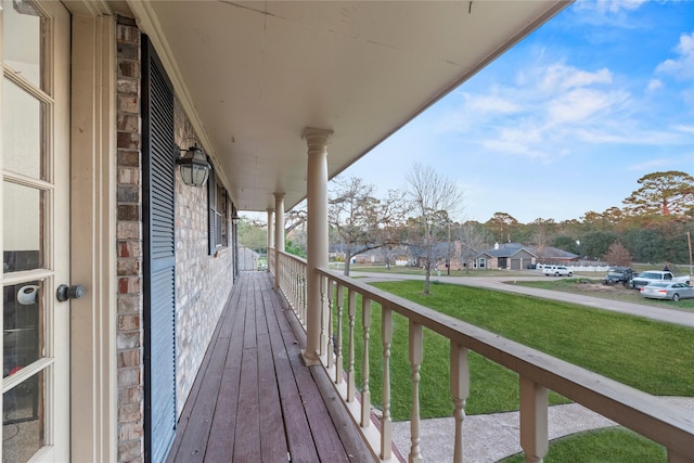 231 Corpus Dr, Magnolia, TX 77354 - wooden terrace with a residential view and a lawn