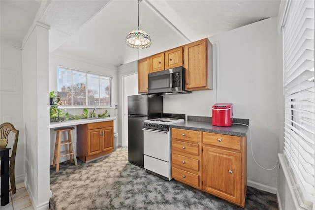 231 Corpus Dr, Magnolia, TX 77354 - kitchen featuring stainless steel microwave, white electric stove, a sink, freestanding refrigerator, and carpet flooring
