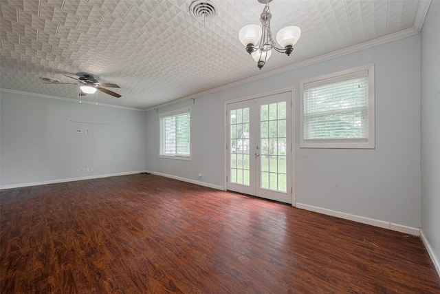 1402 W Norris, El Campo, TX 77437 - empty room featuring ornamental molding, a chandelier, dark wood-style floors, baseboards, and a ceiling fan