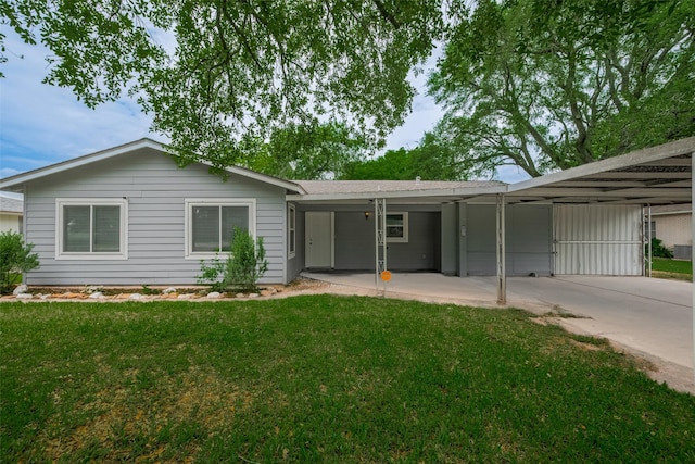 1402 W Norris, El Campo, TX 77437 - view of front of home with a front yard and a carport