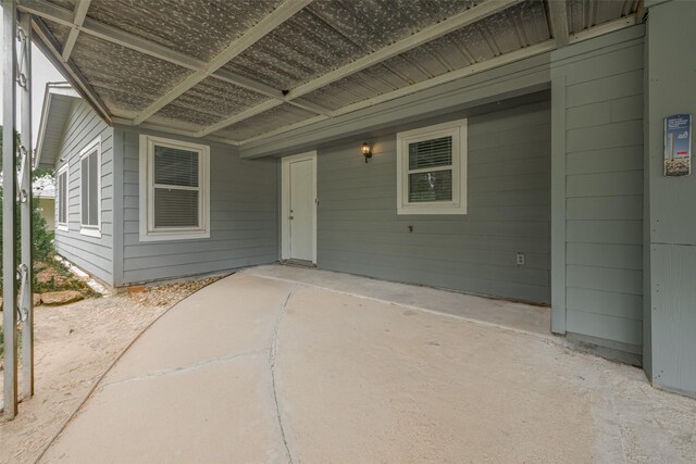 1402 W Norris, El Campo, TX 77437 - view of exterior entry with a patio