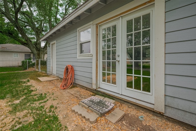 1402 W Norris, El Campo, TX 77437 - property entrance with fence and french doors