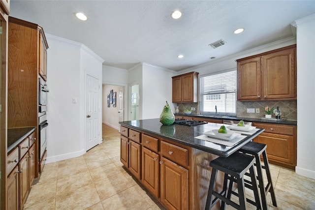 19715 Satinwood Trl, Humble, TX 77346 - kitchen with a kitchen bar, tasteful backsplash, recessed lighting, light tile patterned floors, and brown cabinetry