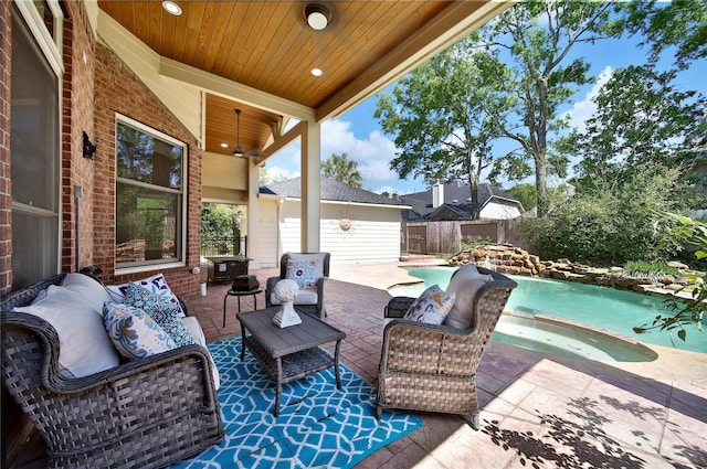19715 Satinwood Trl, Humble, TX 77346 - fenced backyard with an outdoor living space, a patio area, and an in-ground hot tub
