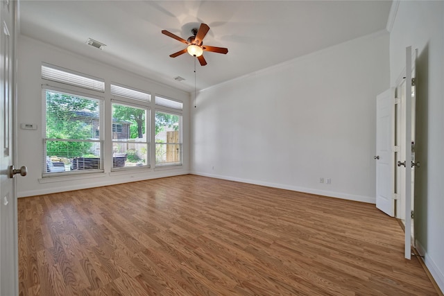 19715 Satinwood Trl, Humble, TX 77346 - spare room featuring wood finished floors, ceiling fan, crown molding, and baseboards