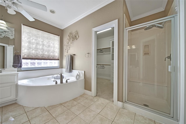19715 Satinwood Trl, Humble, TX 77346 - full bathroom featuring a shower stall, a bath, tile patterned floors, ornamental molding, and a walk in closet