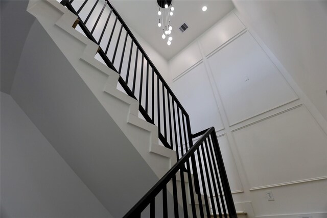 609 E 38th St, Houston, TX 77022 - staircase with a high ceiling