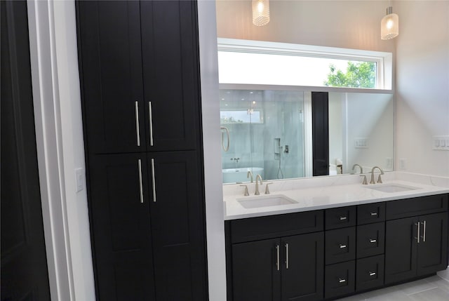 609 E 38th St, Houston, TX 77022 - full bath with double vanity, a shower with shower door, and a tub to relax in