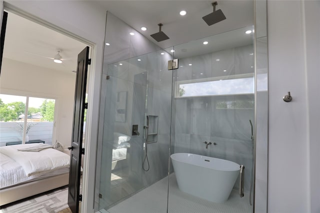 609 E 38th St, Houston, TX 77022 - full bathroom with a shower with shower door, ensuite bath, a soaking tub, a ceiling fan, and tile patterned floors