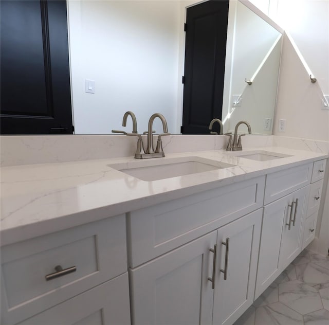 609 E 38th St, Houston, TX 77022 - full bath featuring marble finish floors and double vanity