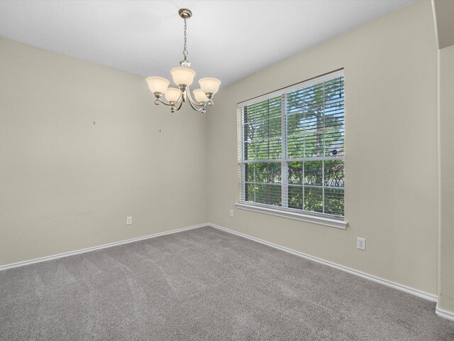 17510 Durham Ridge Ln, Humble, TX 77346 - carpeted spare room featuring a chandelier and baseboards