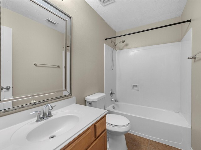 17510 Durham Ridge Ln, Humble, TX 77346 - full bath featuring vanity, toilet, tile patterned floors, shower / tub combination, and a textured ceiling