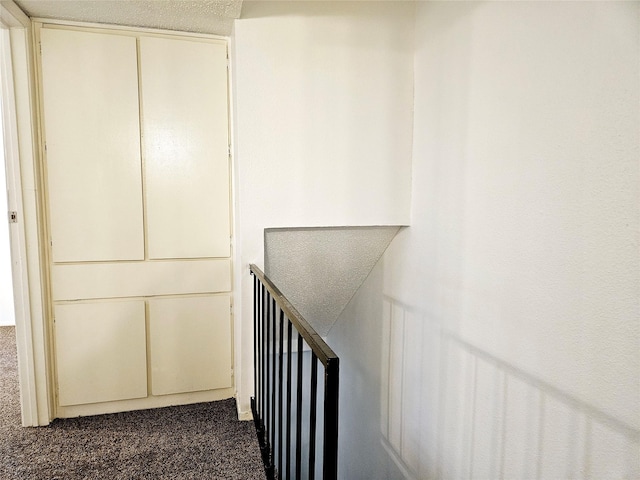 5670 Birchmont Dr Unit C, Houston, TX 77091 - hallway with dark colored carpet