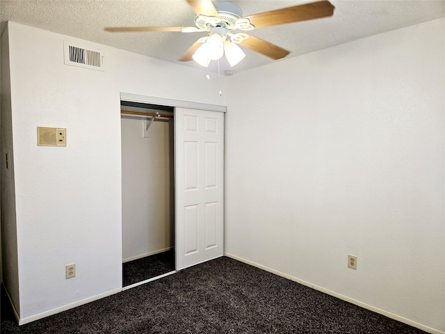 5670 Birchmont Dr Unit C, Houston, TX 77091 - unfurnished bedroom with dark carpet, a closet, ceiling fan, and baseboards