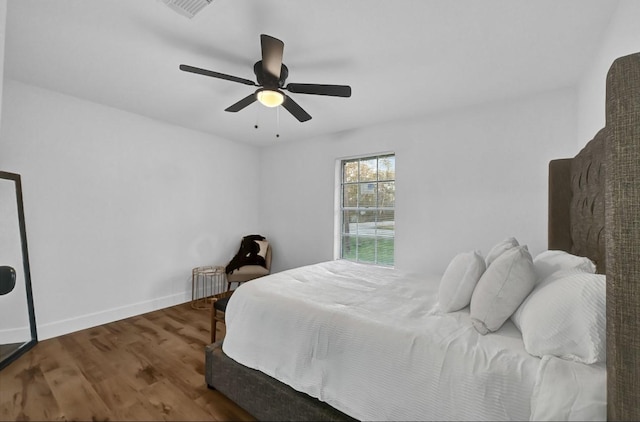 20310 County Road 510f, Brazoria, TX 77422 - bedroom with ceiling fan, wood finished floors, and baseboards