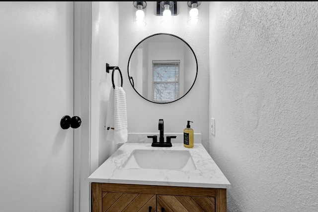 20310 County Road 510f, Brazoria, TX 77422 - bathroom with a textured wall and vanity