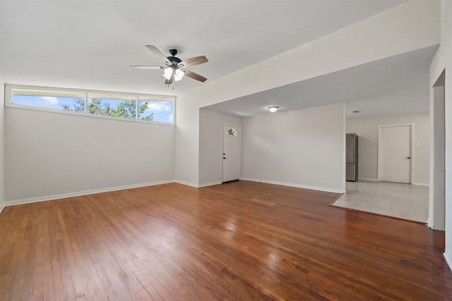127 E Thornton Rd, Houston, TX 77022 - unfurnished room with a ceiling fan, hardwood / wood-style floors, and baseboards