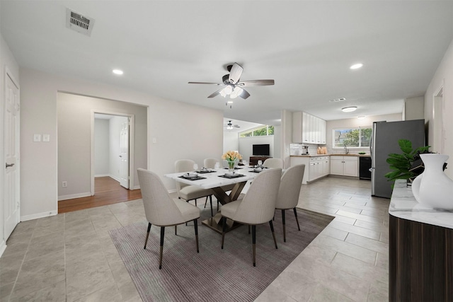 127 E Thornton Rd, Houston, TX 77022 - dining space with a ceiling fan, recessed lighting, baseboards, and light tile patterned flooring