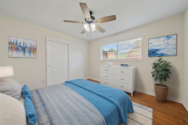 127 E Thornton Rd, Houston, TX 77022 - bedroom with light wood finished floors, baseboards, a closet, and ceiling fan