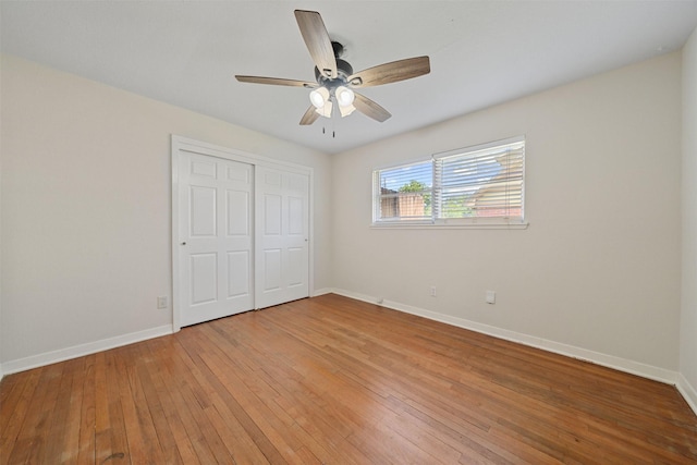 127 E Thornton Rd, Houston, TX 77022 - unfurnished bedroom featuring baseboards, light wood finished floors, a closet, and a ceiling fan