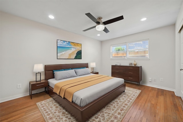 127 E Thornton Rd, Houston, TX 77022 - bedroom with light wood-style floors, baseboards, a ceiling fan, and recessed lighting
