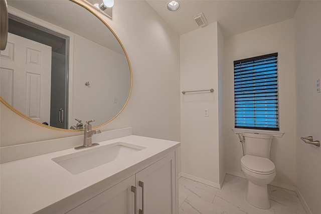 5918 Pendelton Place Dr, Sugar Land, TX 77479 - bathroom featuring marble finish floors, toilet, baseboards, and vanity