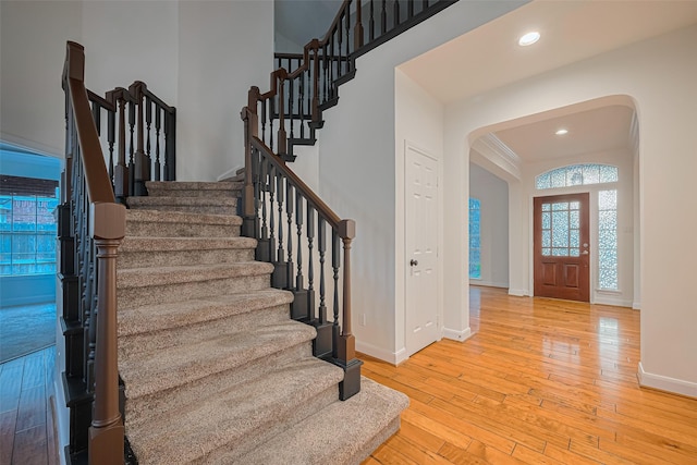 5918 Pendelton Place Dr, Sugar Land, TX 77479 - entryway featuring arched walkways, stairway, hardwood / wood-style floors, baseboards, and recessed lighting