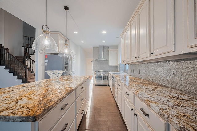 5918 Pendelton Place Dr, Sugar Land, TX 77479 - kitchen with wall chimney range hood, appliances with stainless steel finishes, decorative backsplash, recessed lighting, and hanging light fixtures