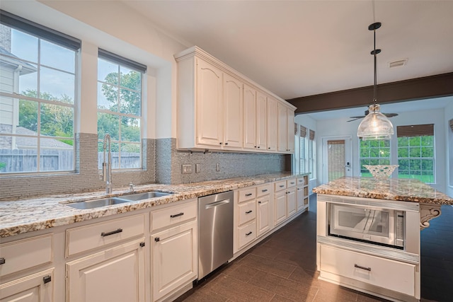 5918 Pendelton Place Dr, Sugar Land, TX 77479 - kitchen with stainless steel appliances, a sink, tasteful backsplash, light stone countertops, and decorative light fixtures