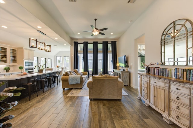 16927 Lupine Meadow Ln, Humble, TX 77346 - living room featuring dark wood-style floors, ceiling fan, recessed lighting, and a chandelier