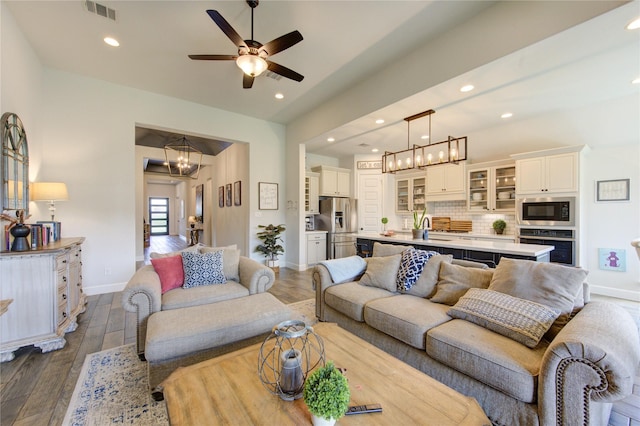 16927 Lupine Meadow Ln, Humble, TX 77346 - living area featuring a chandelier, baseboards, recessed lighting, dark wood finished floors, and ceiling fan