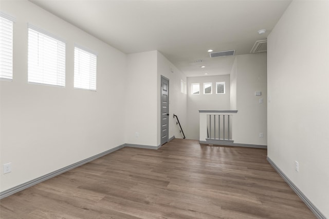 15206 Falco Ln, Magnolia, TX 77354 - unfurnished room featuring attic access, wood finished floors, recessed lighting, a smoke detector, and baseboards