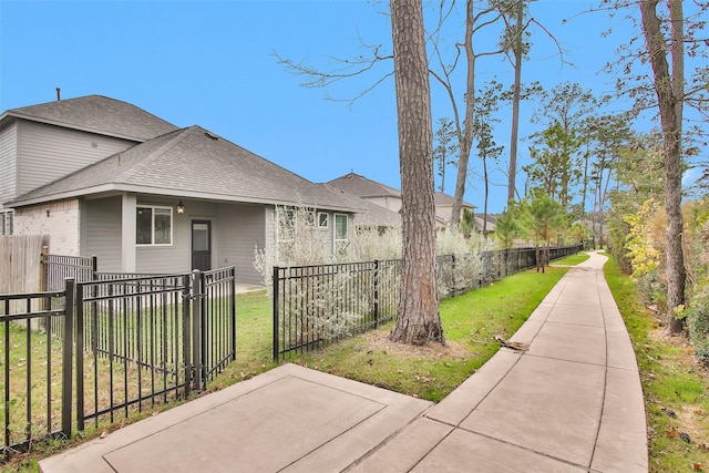 15206 Falco Ln, Magnolia, TX 77354 - view of property exterior with a shingled roof and a patio area