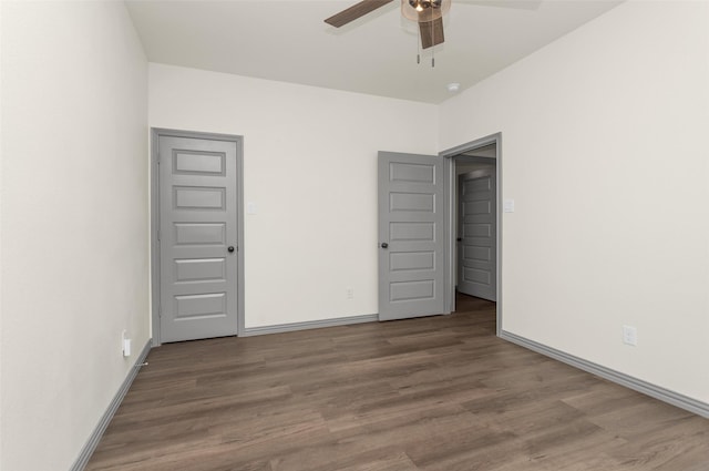 15206 Falco Ln, Magnolia, TX 77354 - unfurnished bedroom featuring wood finished floors, baseboards, and a ceiling fan