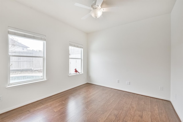 13507 Marblepointe Ln, Cypress, TX 77429 - unfurnished room with wood finished floors, ceiling fan, and baseboards