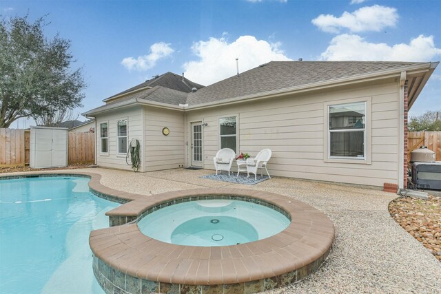 13507 Marblepointe Ln, Cypress, TX 77429 - rear view of house with a patio, a fenced backyard, an in-ground hot tub, and a shingled roof
