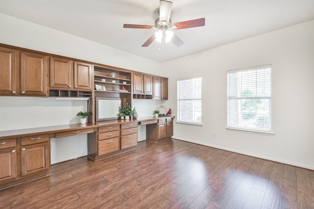 13507 Marblepointe Ln, Cypress, TX 77429 - kitchen featuring open shelves, ceiling fan, dark wood finished floors, brown cabinets, and baseboards