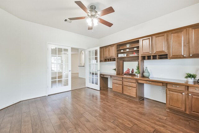 13507 Marblepointe Ln, Cypress, TX 77429 - kitchen featuring french doors, open shelves, ceiling fan, wood finished floors, and brown cabinetry