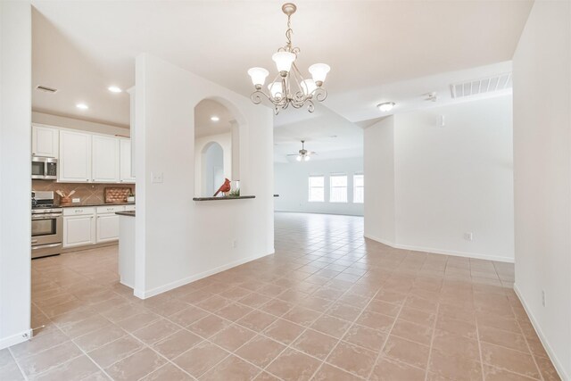 13507 Marblepointe Ln, Cypress, TX 77429 - unfurnished room with a chandelier, arched walkways, recessed lighting, baseboards, and light tile patterned flooring