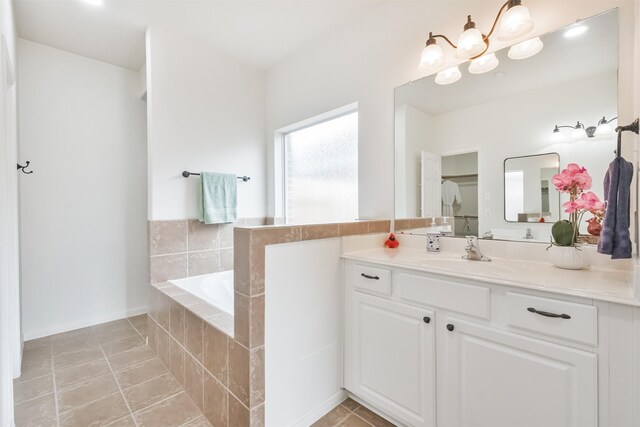 13507 Marblepointe Ln, Cypress, TX 77429 - bathroom featuring a garden tub, vanity, and tile patterned flooring