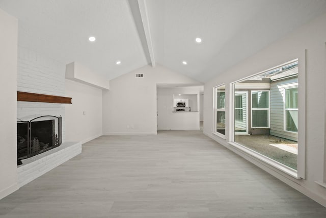 13414 Ravensway Dr, Cypress, TX 77429 - unfurnished living room with light wood-type flooring, baseboards, and a fireplace