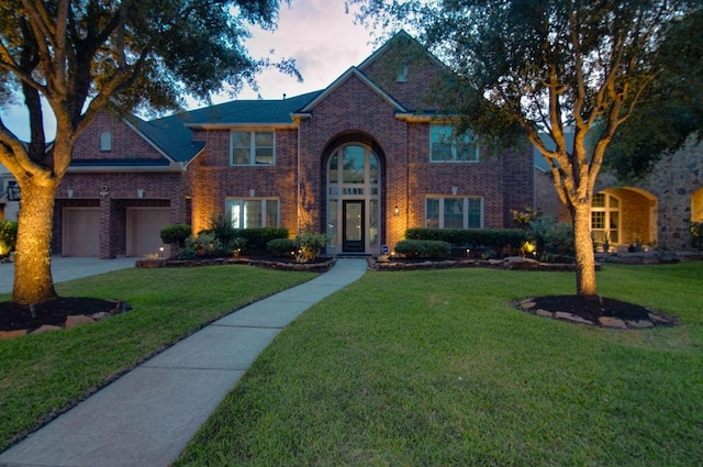 11307 Bentgrove Ln, Cypress, TX 77433 - traditional-style house with brick siding, a front lawn, and driveway
