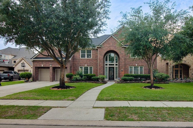 11307 Bentgrove Ln, Cypress, TX 77433 - traditional home featuring concrete driveway, brick siding, a front yard, and a garage