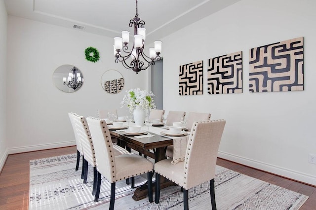 11307 Bentgrove Ln, Cypress, TX 77433 - dining area featuring a chandelier, wood finished floors, and baseboards