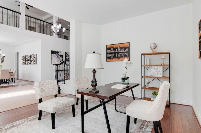 11307 Bentgrove Ln, Cypress, TX 77433 - office featuring a chandelier, wood-type flooring, and baseboards